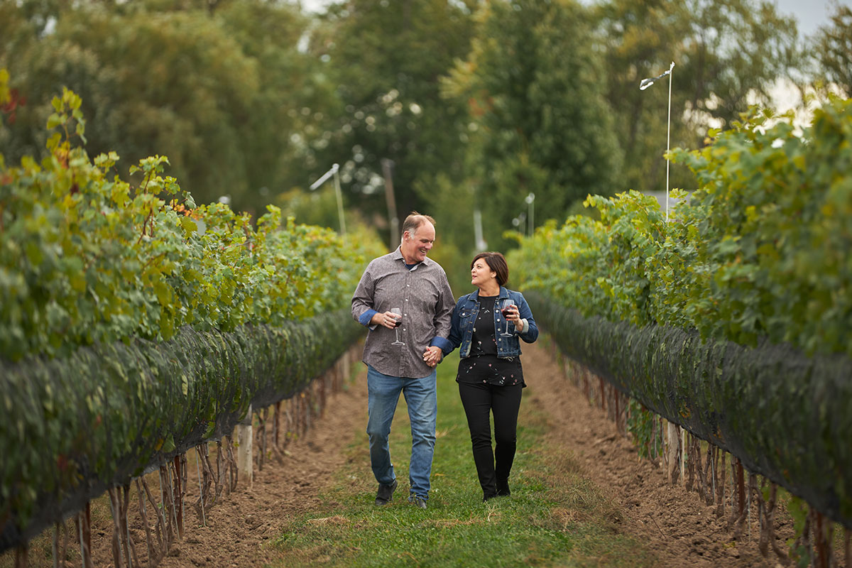 Couple walking in Sprucewood vineyard