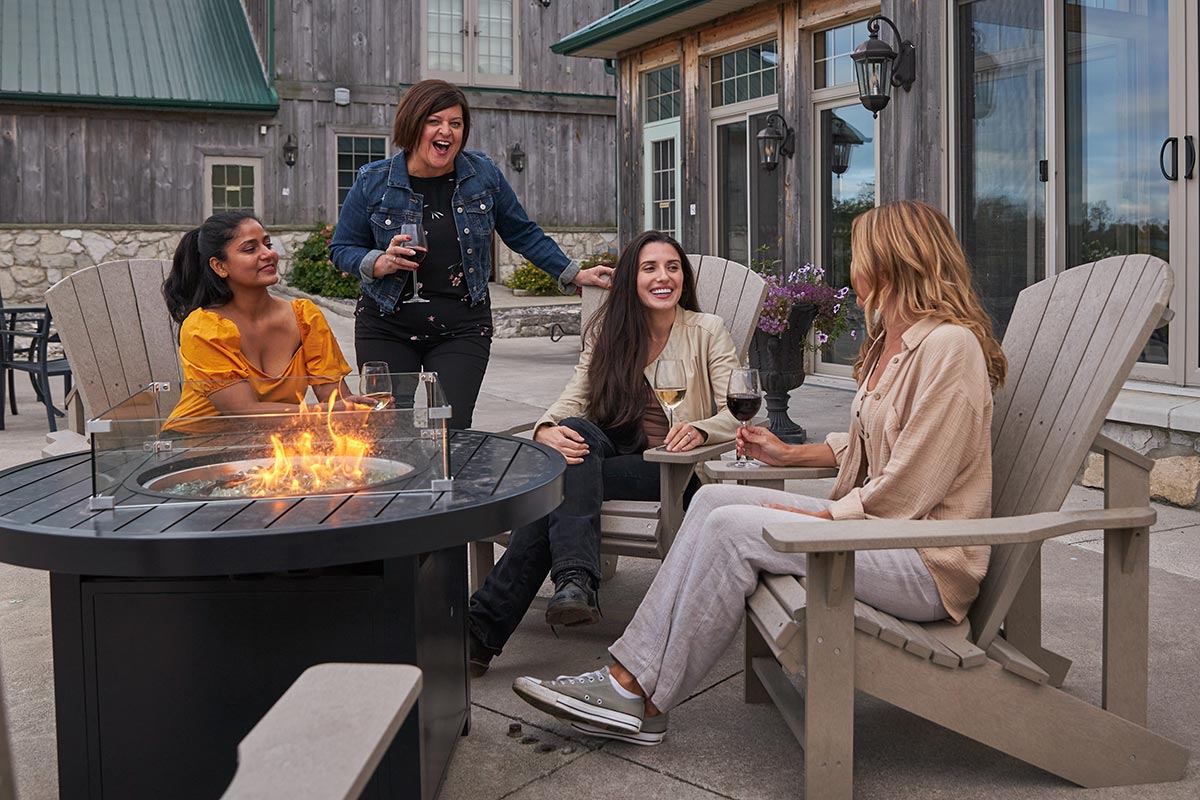 Group of people enjoying wine on Sprucewood patio